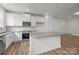 Open kitchen showcasing white cabinetry, stainless steel appliances, and an island at 4113 Walking Ridge Rd # 56, Charlotte, NC 28208