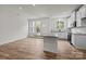Bright, open-concept kitchen featuring a large island and modern, white cabinets at 4113 Walking Ridge Rd # 56, Charlotte, NC 28208