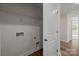Bright laundry room area with washer/dryer hookups and built in storage shelf at 4113 Walking Ridge Rd # 56, Charlotte, NC 28208
