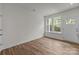 Bright, naturally lit living room with windows and luxury vinyl plank flooring at 4113 Walking Ridge Rd # 56, Charlotte, NC 28208