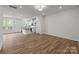 Open-concept living space with luxury vinyl plank flooring, and kitchen at 4113 Walking Ridge Rd # 56, Charlotte, NC 28208