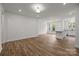 Open-concept living space with natural light, luxury vinyl plank flooring, and island at 4113 Walking Ridge Rd # 56, Charlotte, NC 28208