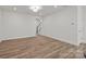Spacious living room with access to stairs and vinyl plank flooring at 4113 Walking Ridge Rd # 56, Charlotte, NC 28208