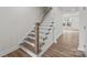 Staircase with wood stairs, white risers and white railing at 4113 Walking Ridge Rd # 56, Charlotte, NC 28208