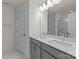 Bathroom featuring double sinks, quartz countertops, and contemporary fixtures at 4117 Walking Ridge Rd # 55, Charlotte, NC 28208