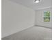 Standard bedroom with neutral paint, carpet, and a single window at 4117 Walking Ridge Rd # 55, Charlotte, NC 28208