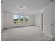Spacious bedroom featuring three large windows that illuminate the room at 4117 Walking Ridge Rd # 55, Charlotte, NC 28208