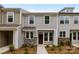 Charming townhome boasts gray siding, stone accents, and a welcoming front entrance at 4117 Walking Ridge Rd # 55, Charlotte, NC 28208