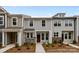 Inviting townhouse showcasing stone accents, gray siding and a well manicured landscape at 4117 Walking Ridge Rd # 55, Charlotte, NC 28208