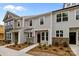 Charming townhome boasts gray siding, stone accents, and a welcoming front entrance at 4117 Walking Ridge Rd # 55, Charlotte, NC 28208