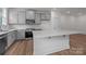 Bright kitchen features white cabinets, quartz countertops, and stainless steel appliances at 4117 Walking Ridge Rd # 55, Charlotte, NC 28208