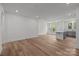 Open floorplan kitchen features a center island, gray cabinetry, and wood-look floors at 4117 Walking Ridge Rd # 55, Charlotte, NC 28208