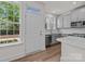 Bright kitchen features white cabinets, quartz countertops, and stainless steel appliances at 4117 Walking Ridge Rd # 55, Charlotte, NC 28208