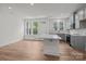 Bright kitchen features gray cabinets, stainless appliances, and a center island at 4117 Walking Ridge Rd # 55, Charlotte, NC 28208
