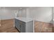 Modern kitchen with a large center island, gray cabinets and stainless steel appliances at 4117 Walking Ridge Rd # 55, Charlotte, NC 28208