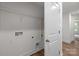 A well-lit laundry room offers convenience with essential hookups at 4117 Walking Ridge Rd # 55, Charlotte, NC 28208