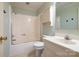 Bathroom features a shower-tub combo, toilet, and vanity at 457 Birchwood Ne Trl, Concord, NC 28025