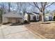 Charming single-Gathering home featuring a covered carport and a well-maintained front yard at 457 Birchwood Ne Trl, Concord, NC 28025