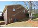 Exterior shot of the backyard featuring a full brick wall and green grass at 4866 E Nc Hwy 150 Hwy, Lincolnton, NC 28092