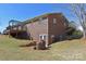 Exterior of the backyard with a brick facade, a deck, and a walk-out basement at 4866 E Nc Hwy 150 Hwy, Lincolnton, NC 28092