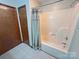 Functional bathroom with a shower-tub combo, simple curtain, and nearby door at 4866 E Nc Hwy 150 Hwy, Lincolnton, NC 28092