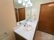 Well-lit bathroom featuring double sinks with a large mirror and neutral walls at 4866 E Nc Hwy 150 Hwy, Lincolnton, NC 28092
