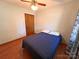This simple bedroom features wood-look floors, a double bed, and neutral walls at 4866 E Nc Hwy 150 Hwy, Lincolnton, NC 28092