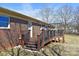 New wooden deck features dark railings, stairs to the yard, and a metal pergola at 4866 E Nc Hwy 150 Hwy, Lincolnton, NC 28092