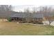 Charming brick home featuring a cozy front porch and meticulously maintained landscaping at 4866 E Nc Hwy 150 Hwy, Lincolnton, NC 28092
