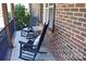 Inviting front porch with rocking chairs and cozy pillows at 4866 E Nc Hwy 150 Hwy, Lincolnton, NC 28092