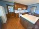 Kitchen featuring wood cabinets, an island, a microwave, and stainless steel appliances at 4866 E Nc Hwy 150 Hwy, Lincolnton, NC 28092