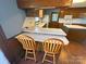 Kitchen featuring wood cabinets, laminate counters, an island, and bar stool seating at 4866 E Nc Hwy 150 Hwy, Lincolnton, NC 28092