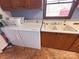 Convenient laundry area with a washer, dryer, sink, and laminate flooring at 4866 E Nc Hwy 150 Hwy, Lincolnton, NC 28092