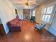 Bright living room featuring a brick fireplace and hardwood floors at 4866 E Nc Hwy 150 Hwy, Lincolnton, NC 28092