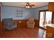 Cozy living room with a ceiling fan, hardwood floors, and sliding glass door at 4866 E Nc Hwy 150 Hwy, Lincolnton, NC 28092