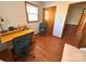 Well-lit home office featuring laminate floors, a functional desk, and comfortable seating for productivity at 4866 E Nc Hwy 150 Hwy, Lincolnton, NC 28092