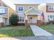 Charming home exterior boasts inviting curb appeal, a walkway, and an American flag, perfect for families at 531 Watson St # 7, Davidson, NC 28036