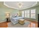 This spacious main bedroom includes a king-sized bed, tray ceiling, and plantation shutters at 55726 Thrashers Ct, Fort Mill, SC 29707