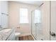 Modern bathroom featuring a glass-enclosed shower, granite countertop, and a bright window at 604 Smith St # A, Mooresville, NC 28115