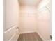 Spacious closet featuring a modern laminate floor and white walls with wire shelving at 616 Smith St # A, Mooresville, NC 28115