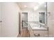 Bathroom featuring a double sink vanity with stone countertops and modern fixtures and framed mirrors at 616 Smith St # B, Mooresville, NC 28115