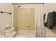 Bathroom with tiled shower-tub combo with granite countertop vanity and decorative shower curtain at 6322 Old Pineville Rd # E, Charlotte, NC 28217