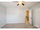 Bedroom with ceiling fan, and doorway to hallway at 6322 Old Pineville Rd # E, Charlotte, NC 28217