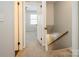 Hallway featuring carpeted floors and access to other parts of the home at 6322 Old Pineville Rd # E, Charlotte, NC 28217