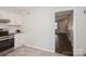 Contemporary kitchen featuring stainless steel appliances, white cabinets, and tile flooring at 6322 Old Pineville Rd # E, Charlotte, NC 28217