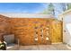 Enclosed brick patio with unique brick design, wood fence, and comfortable seating at 6322 Old Pineville Rd # E, Charlotte, NC 28217