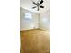 This cozy carpeted bedroom offers a ceiling fan, window for natural light, and neutral walls at 742 Aquadale Rd, Albemarle, NC 28001