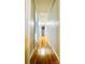 Bright hallway featuring wood-look floors and painted paneled walls at 742 Aquadale Rd, Albemarle, NC 28001