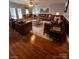 This living room features cozy leather furniture and natural lighting at 742 Aquadale Rd, Albemarle, NC 28001