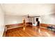 Bright living room with hardwood floors and wainscotting showcasing an open layout and stylish design at 742 Aquadale Rd, Albemarle, NC 28001